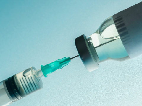 Vaccine serum and needle 