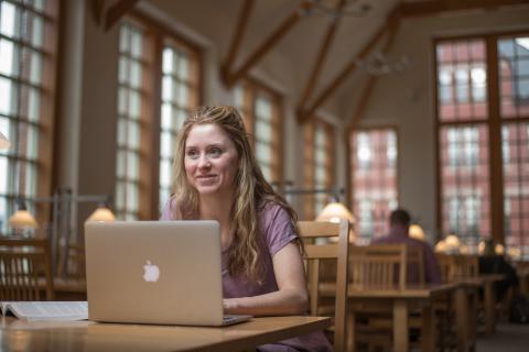 Student on their laptop in the library